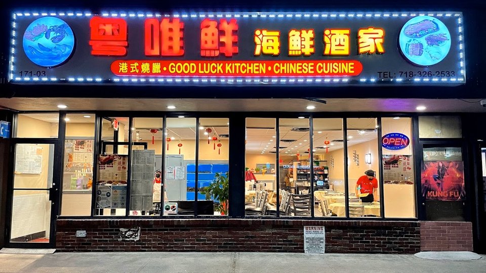 Chinese restaurant dishes on white plates.